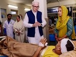 Jammu and Kashmir CM Omar Abdullah meets victims of the recent bus crash during a visit to the Government Medical College (GMC), in Udhampur, on Wednesday. (PTI)