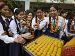 Students in Lucknow celebrate their success in the UP Board examinations on Thursday. (Deepak Gupta/HT Photo)