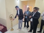 Vice President Tushar Kanti Sethapaty and Technical Member (Centre) B B Mohapatra lead the ceremonial lighting of the lamp to mark the inaugural hearing of the GSTAT Ranchi State Bench on Thursday. (HT Photo)