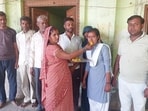 Vindesh celebrates her success with her family. (HT)