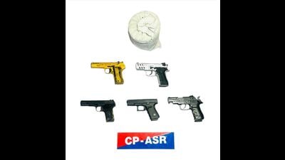 The recovered weapons include two 9MM Glock and three .30-bore pistols along with two live cartridges. (HT)