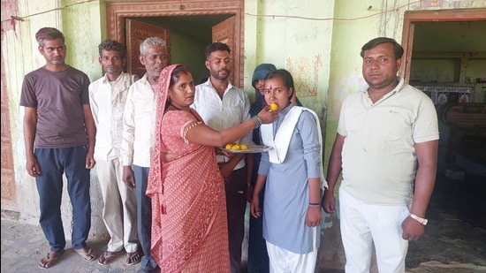 Vindesh celebrates her success with her family. (HT)