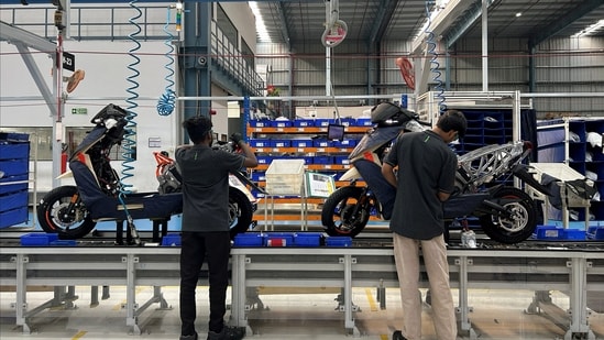 FILE PHOTO: Workers assemble Ather 450X electric scooter inside Ather Energy's manufacturing facility in Hosur (REUTERS)