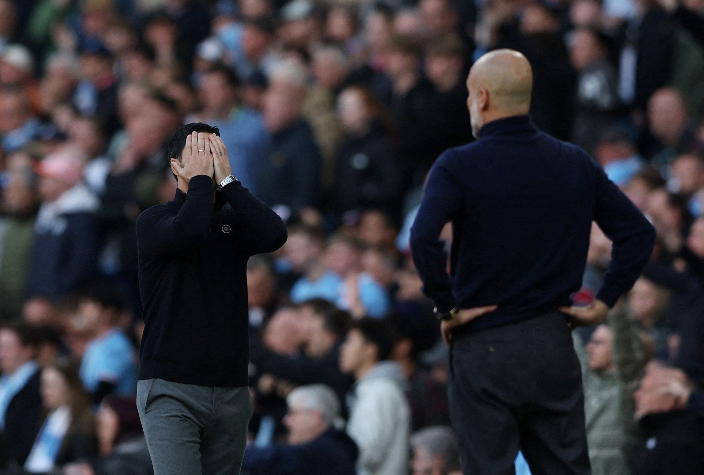 Mikel Arteta (left) and Pep Guardiola, managers at Arsenal and Manchesyer City respectively, during their Premier League match on Sunday. (Reuters) Mikel Arteta (left) and Pep Guardiola, managers at Arsenal and Manchesyer City respectively, during their Premier League match on Sunday. (Reuters)