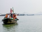 Prime Minister Narendra Modi with a camera in a boat as he visits the Hooghly River, in Kolkata on Friday. Prime Minister Narendra Modi with a camera in a boat as he visits the Hooghly River, in Kolkata on Friday.