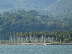 Commuters ride a bus past Campbell Bay at Great Nicobar island (AFP FILE)