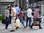 Delhi Police officials and forensic team members are seen at a residence in Kailash Hills, Amar Colony area, in New Delhi.