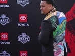Miami offensive lineman Francis Mauigoa poses on the red carpet before the first round of the NFL football draft, Thursday, April 23, 2026, in Pittsburgh.