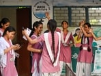 Students celebrate after UP board class 10th and 12th results were declared at Chet Ram Sharma College of Education in sector 45, in Noida on Thursday (Sunil Ghosh / Hindustan Times)