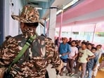 Voters stand in a queue at a polling station to cast their vote in the West Bengal Assembly elections at Berhampore in Murshidabad on Thursday. (ANI) Voters stand in a queue at a polling station to cast their vote in the West Bengal Assembly elections at Berhampore in Murshidabad on Thursday. (ANI)