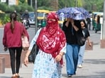 Commuters step out on a hot summer afternoon near Mandi House, in New Delhi, India, on Friday, April 24, 2026. 