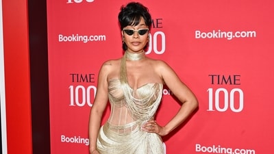 La La Anthony was a showstopper on the red carpet, wearing a custom-made, gold-toned fringe and lace gown designed by Pajtim Raci. The dress featured intricate metallic fringe detailing, a sheer corset-style bodice, and a high thigh-slit. She accessorised with a matching choker, pointed-toe heels, and cat-eye sunglasses. (Evan Agostini/Invision/AP) La La Anthony was a showstopper on the red carpet, wearing a custom-made, gold-toned fringe and lace gown designed by Pajtim Raci. The dress featured intricate metallic fringe detailing, a sheer corset-style bodice, and a high thigh-slit. She accessorised with a matching choker, pointed-toe heels, and cat-eye sunglasses. (Evan Agostini/Invision/AP)