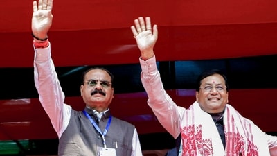 Nalbari: Union Ports, Shipping and Waterways Minister Sarbananda Sonowal, right, waves to the gathering during a public rally in support of BJP candidate for Tihu constituency Chandra Mohan Patowary, left, ahead of Assam Assembly Election, in Nalbari district, Sunday, April 5, 2026. (PTI) Nalbari: Union Ports, Shipping and Waterways Minister Sarbananda Sonowal, right, waves to the gathering during a public rally in support of BJP candidate for Tihu constituency Chandra Mohan Patowary, left, ahead of Assam Assembly Election, in Nalbari district, Sunday, April 5, 2026. (PTI)