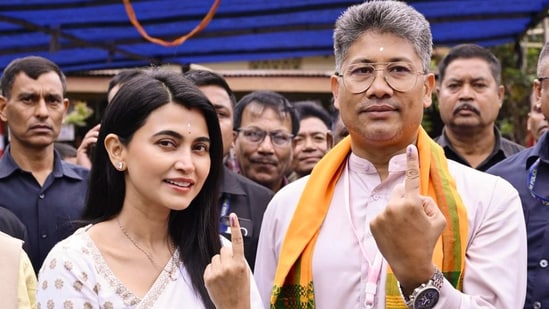 BJP candidate from Jagiroad Assembly constituency Pijush Hazarika, and his wife Aimee Baruah, show ink-marked fingers after casting their votes during the Assam Assembly elections, in Morigaon, Assam, Thursday, April 9, 2026. (PTI)