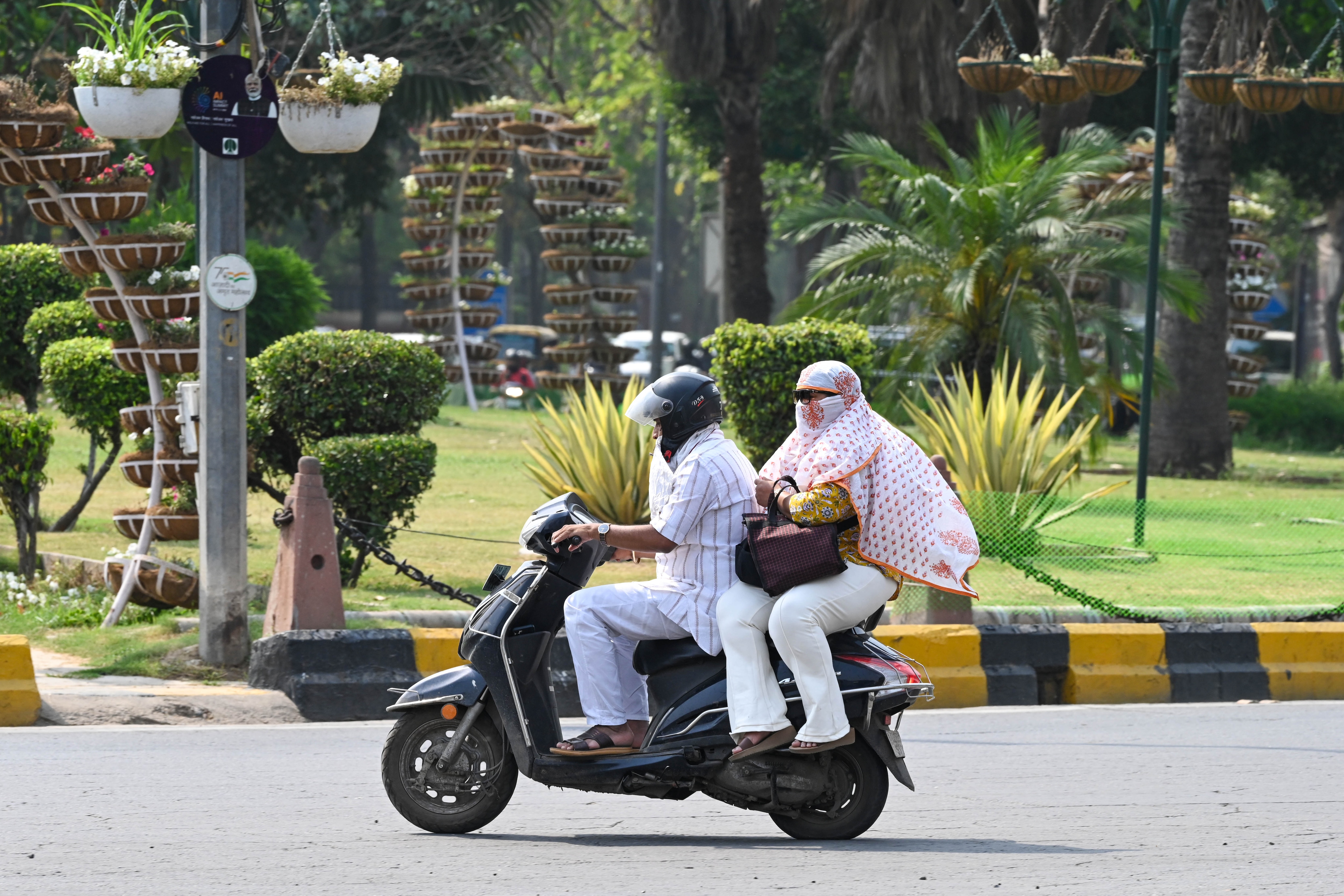 New Delhi, India - April 24, 2026: Commuters step out on a hot summer afternoon near Mandi House, in New Delhi, India, on Friday, April 24, 2026. (Photo by Sanjeev Verma/ Hindustan Times) (Hindustan Times) New Delhi, India - April 24, 2026: Commuters step out on a hot summer afternoon near Mandi House, in New Delhi, India, on Friday, April 24, 2026. (Photo by Sanjeev Verma/ Hindustan Times) (Hindustan Times)