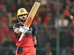 Virat Kohli celebrates after scoring a half-century. 