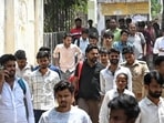 Candidates emerging from an exam centre in Lucknow on Saturday. (MUSHTAQ ALI/HT)