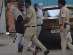 Accused Rahul Meena being brought to Amar Colony Police Station in New Delhi.