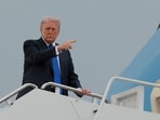 US President Donald Trump boards Air Force One en route to Palm Beach International Airport.