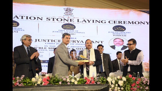 Chief justice of Punjab and Haryana high court, Sheel Nagu, honouring CJI Surya Kant during the convocation in Bhiwani on Saturday. (HT Photo)