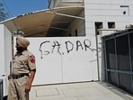 A policeman standing guard outside the house of former cricketer and Rajya Sabha member Harbhajan Singh after protesters defaced his gate in Jalandhar on Saturday. (HT Photo)