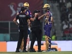 Umpires speak to Kolkata Knight Riders' Angkrish Raghuvanshi during the Indian Premier League 2026 match against Lucknow Super Giants