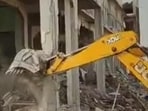 An illegal madrasa building being demolished in UP’s Sant Kabir Nagar district on April 26. (Sourced)