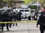 Police respond to the scene of a shooting near Endeavor Health Swedish Hospital, Saturday, April 25, 2026, in Chicago. (John J. Kim/Chicago Tribune via AP)