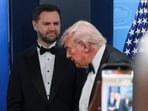 Donald Trump walks next to Vice President JD Vance at a press briefing at the White House
