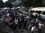 People remain at the site of an explosion after a bomb attack at El Tunel, on the Popayan-Cali road, in Cajibio, Cauca department, Colombia, on April 25, 2026. 