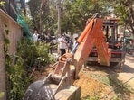 Teams deployed to remove debris, clear right of way after anti-encroachment drive across 17 colonies where illegal structures were demolished. (HT)