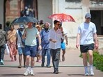 Tourists seen shielding themselves from the scorching heat at Humayun's Tomb on Sunday. (Sanchit Khanna/HT Photo)