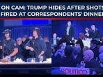 Trump takes cover behind table Trump takes cover behind table