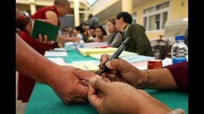 A Buddhist monk gets his finger inked before casting his ballot at a polling station in Dharamsala on Sunday. (AFP) A Buddhist monk gets his finger inked before casting his ballot at a polling station in Dharamsala on Sunday. (AFP)