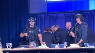 U.S. President Donald Trump is escorted out as a shooter opens fire during the annual White House Correspondents' Association dinner in Washington, D.C., U.S., April 25, 2026, in this screen capture from video. REUTERS/Bo Erickson (REUTERS)