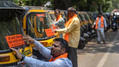 iiMumbai, India - April 26, 2026: MNS workers distribute Marathi stickers to rickshaw drivers, to speak marathi at Kamraj Nagar bus stop, Ghatkopar east in Mumbai, India, on Sunday, April 26, 2026. (Photo by Satish Bate/ Hindustan Times) (Hindustan Times) iiMumbai, India - April 26, 2026: MNS workers distribute Marathi stickers to rickshaw drivers, to speak marathi at Kamraj Nagar bus stop, Ghatkopar east in Mumbai, India, on Sunday, April 26, 2026. (Photo by Satish Bate/ Hindustan Times) (Hindustan Times)