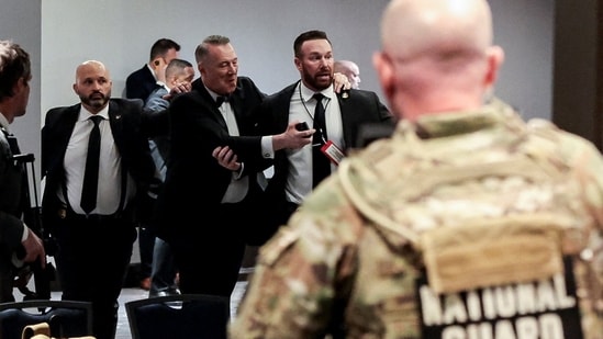 Security officials evacuate guests as a shooter opens fire during the annual White House Correspondents' Association dinner in Washington, D.C., U.S., April 25, 2026. REUTERS/Jonathan Ernst(REUTERS)