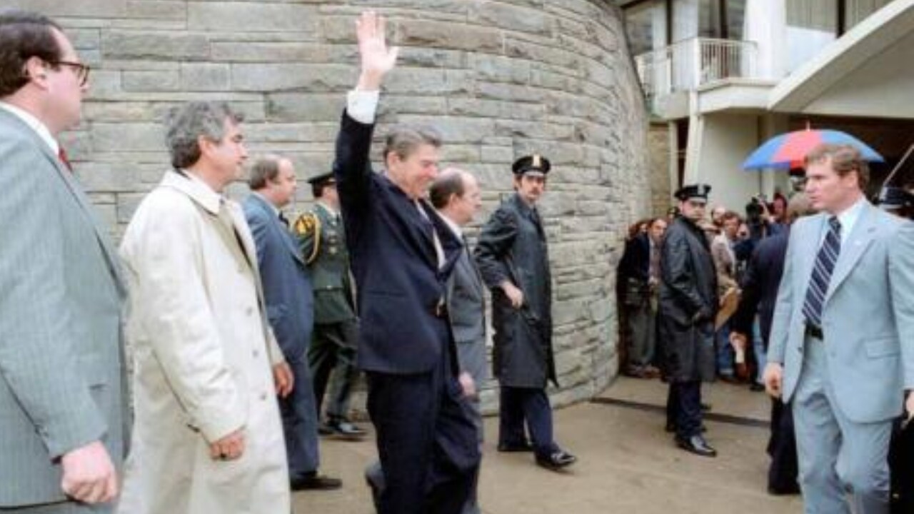 President Reagan waves to crowd immediately before being shot in an assassination attempt after exiting Washington Hilton Hotel. 03/30/1981. (Ronald Reagan presidential library) President Reagan waves to crowd immediately before being shot in an assassination attempt after exiting Washington Hilton Hotel. 03/30/1981. (Ronald Reagan presidential library)