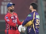 Kolkata Knight Riders' Rinku Singh, right, shakes hands with Lucknow Super Giants captain Rishabh Pant after their win in super over during the IPL match