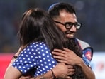 Punjab Kings' Yuzvendra Chahal, back, and the team's co-owner Preity Zinta celebrate after the team won the IPL match against Delhi Capitals