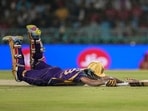 Kolkata Knight Riders' Angkrish Raghuvanshi dives to reach the crease during the IPL match against Lucknow Super Giants