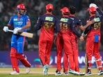 Delhi Capitals' Axar Patel walks back to the pavilion after his dismissal by Royal Challengers Bengaluru's Bhuvneshwar Kumar during the IPL match