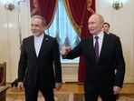 Russian President Vladimir Putin, right, and Iranian foreign minister Abbas Araghchi walk to attend talks in St Petersburg, Russia, on Monday, April 27, 2026.