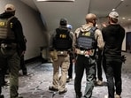 Law enforcement personnel patrol the venue, following a shooting incident during the annual White House Correspondents' Association dinner, in Washington, D.C., U.S., April 26, 2026. (REUTERS/Ken Cedeno)