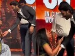 Dhanush stops fan from touching his feet at Kara pre-release event. Dhanush stops fan from touching his feet at Kara pre-release event.