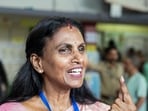 NDA candidate from Vattiyoorkavu constituency, R. Sreelekha shows her ink-marked finger after casting her vote for the Kerala assembly elections, at booth number 104 of Cotton Hill School, in Thiruvananthapuram on Thursday. 