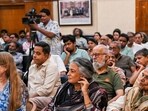 Family members, friends, and colleagues of photojournalist Raghu Rai and British journalist Mark Tully during a memorial meeting at the Press Club of India, in New Delhi, on Tuesday. (ANI)