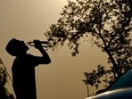 New Delhi, India – April 27, 2026: A man drinks water on a hot day as temperatures rise near Shanti Stupa in New Delhi, India, on Monday, April 27, 2026. The city continues to witness intense heatwave conditions, prompting people to take precautions against the scorching weather. (Photo by Raj K Raj/Hindustan Times)