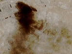 A satellite view of smoke billowing at a Saudi Aramco oil facility after a reported attack by Iranian drones