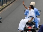 Chief Minister and AITC chairperson Mamata Banerjee riding pillion on a bike during the padayatra (rally) from Jadavpur to Gopal Nagar on the last day of campaign ahead of 2nd phase of Assembly Election in Kolkata, India, on Monday.